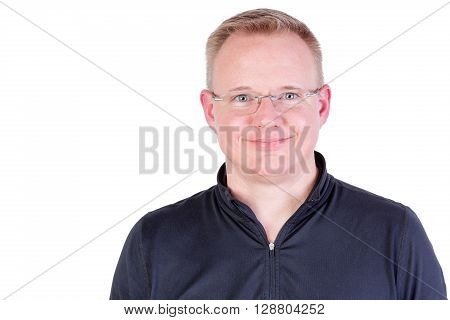 Attractive blond man wearing glasses with a genuine friendly smile and green eyes looking directly at the camera head and shoulders isolated on white