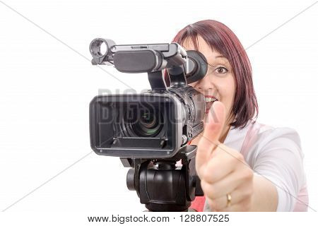 a pretty camerawoman with a professional camera on white