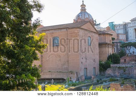 ROME, ITALY - APRIL 8, 2016: Senate and  Roman's forum with ruins of important ancient government buildings started 7th century BC and  Altar of the Fatherland (Altare della Patria) at the background