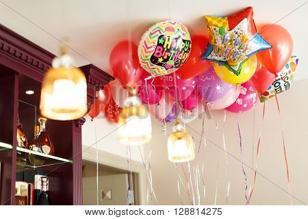 Colorful red balloon that says Happy Birthday