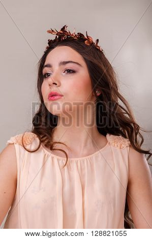 Portrait of a gorgeous brunette on a light background. Chic hair eyes and eyebrows.