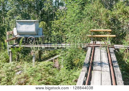 MILLWOOD SOUTH AFRICA - MARCH 4 2016: A mine-cart and track at the historic Bendigo gold mine at Church Millwood. All mining operations stopped in 1892