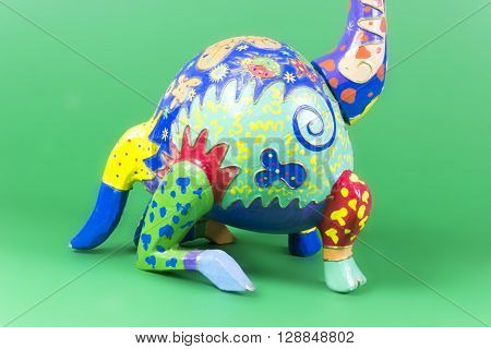 handicraft, craftwork, workmanship, giraffe, camelopard, colorful, colourful, colored, green background