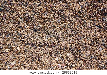 A photo background with different brown stones.