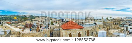 Panoramic view of the old city with the stone domes of the Synagogues and the golden cupola of the Dome of the Rock Jerusalem Israel.