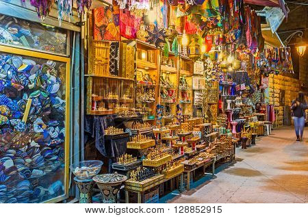 The souvenir stall in Ben Yehuda street offers the handmade wooden chess arabian lights colorful bags and other tourist goods Jerusalem Israel.
