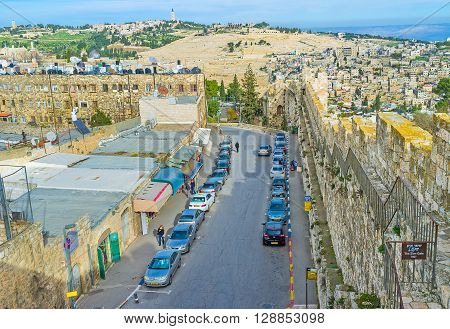 JERUSALEM ISRAEL - FEBRUARY 18 2016: The street along the city rampart from the Zion Gate leads down to the Western Wall on February 18 in Jerusalem.
