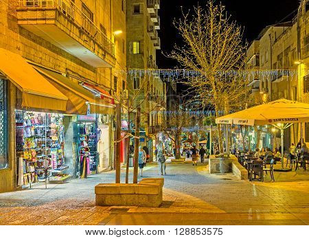 JERUSALEM ISRAEL - FEBRUARY 17 2016: The Ben Yehuda street is the part of the tourist neighborhood and offers a lot of different sovenirs in its tiny stalls on February 17 in Jerusalem.