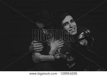 Acting. Man and woman in an interesting way on a dark background.