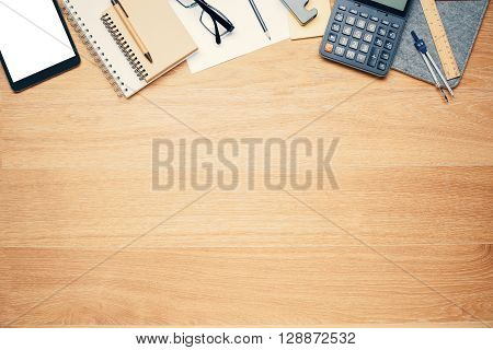 Topview of wooden desktop with office tools. Mock up