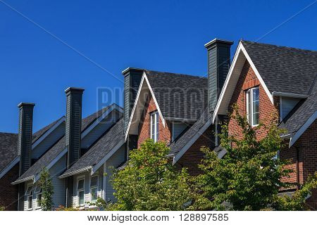 Modern residential building against blue sky in North America.