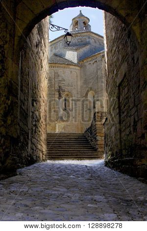 Saint Guilhem le desert church in a cloudy day Details in Saint Guilhem le desert a town in south of France