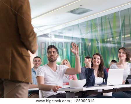 close up of teacher hand with marker while teaching lessons in school  classroom to students