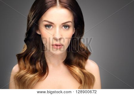 Strong healthy hair. Solar ombre, natural hairstyle long hair