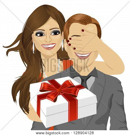 woman covering her boyfriend's eyes standing behind man with gift isolated on white background