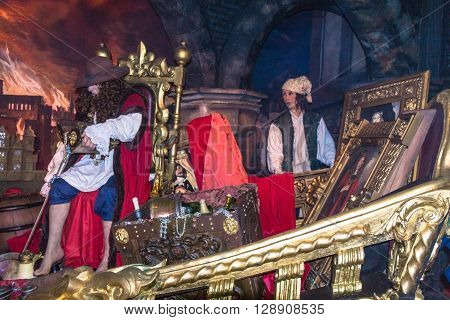 LONDON UK - JUNE 7 2015:Historical scene. Wax figures of Art dealer and his assistant at one of halls of historical part of Madame Tussauds museum. Madame Tussauds London is famous for recreating famous people and celebrities in wax.