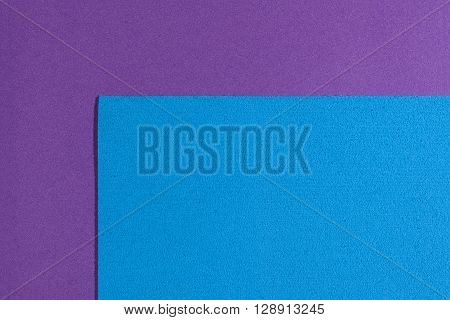 Eva foam ethylene vinyl acetate sponge plush blue surface on purple smooth background