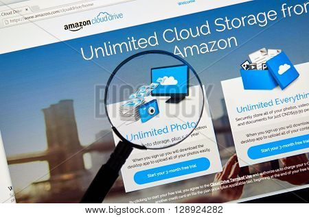 MONTREAL CANADA - MAY 8 2016 : Amazon Cloud Drive web page under magnifying glass. Amazon Cloud Drive is a web storage application from Amazon.
