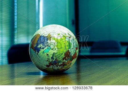 world globe sitting on a desk.vintage world globe.
