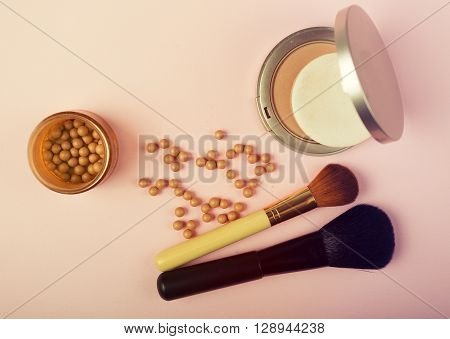 Makeup Essentials On A Pink Background