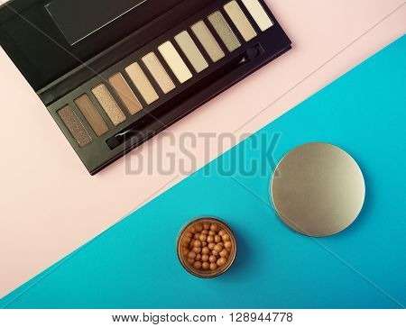 Makeup Essentials On A Pink Background