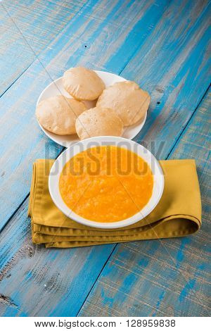 Aamras or Aam Ras Puri: Puri which is an indian fried small bread and alphonso mango pulp is a popular lunch especially during Padwa, the Marathi new year, maharashtrian lunch/dinner menu