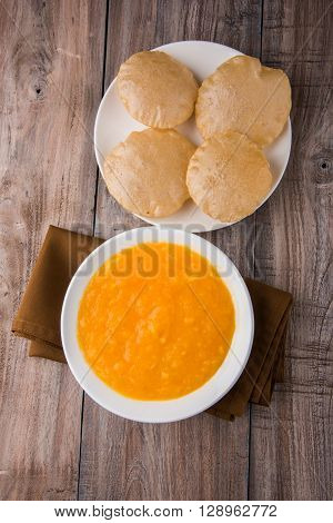 Aamras or Aam Ras Puri: Puri which is an indian fried small bread and alphonso mango pulp is a popular lunch especially during Padwa, the Marathi new year, maharashtrian lunch/dinner menu