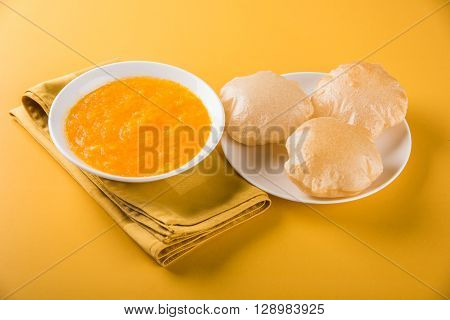 Aamras or Aam Ras Puri: Puri which is an indian fried small bread and alphonso mango pulp is a popular lunch especially during Padwa, the Marathi new year, maharashtrian lunch/dinner menu