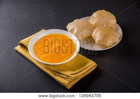 Aamras or Aam Ras Puri: Puri which is an indian fried small bread and alphonso mango pulp is a popular lunch especially during Padwa, the Marathi new year, maharashtrian lunch/dinner menu
