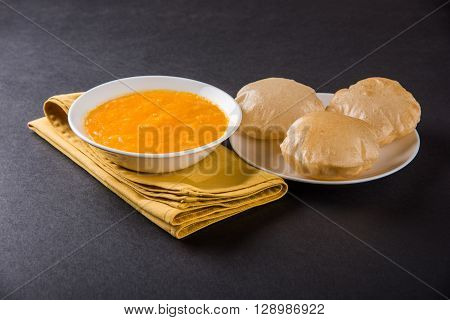 Aamras or Aam Ras Puri: Puri which is an indian fried small bread and alphonso mango pulp is a popular lunch especially during Padwa, the Marathi new year, maharashtrian lunch/dinner menu