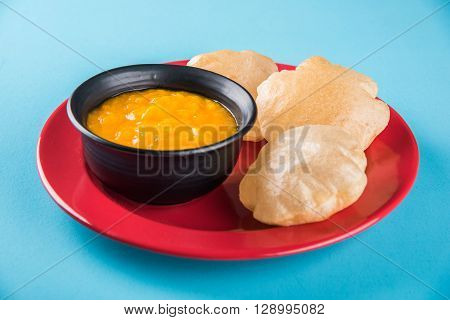 Aamras or Aam Ras Puri: Puri which is an indian fried small bread and alphonso mango pulp is a popular lunch especially during Padwa, the Marathi new year, maharashtrian lunch/dinner menu