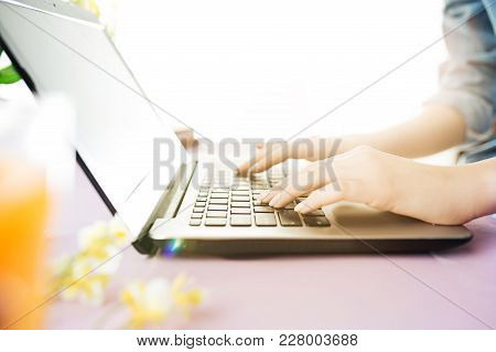 Woman And Fruit Diet While Working On Computer In Office. Female Hands On Keyboard. Side View On Wom