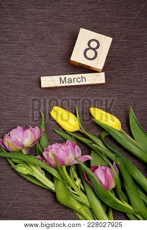 The Inscription On March 8 With Flowers On A Gray Background