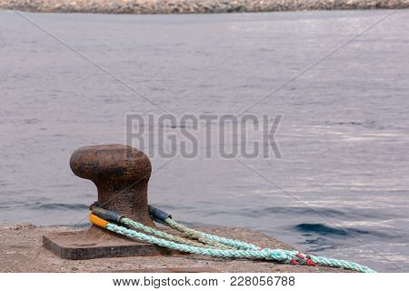 Photo Picture Of A Rusty Metal Mooring Bolard For Big Ship