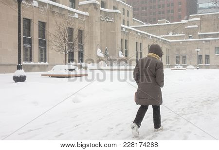 Determined Woman Braves The Weather Elements Outdoors As She Commutes To Work Downtown Chicago In A 