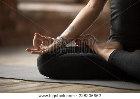 Young Sporty Woman Practicing Yoga, Doing Padmasana Exercise, Lotus Pose, With Mudra Gesture, Workin