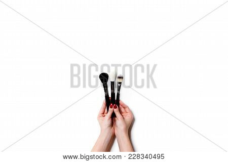 Female Hand Holding Professional Make-up Brushe Isolated On White Background