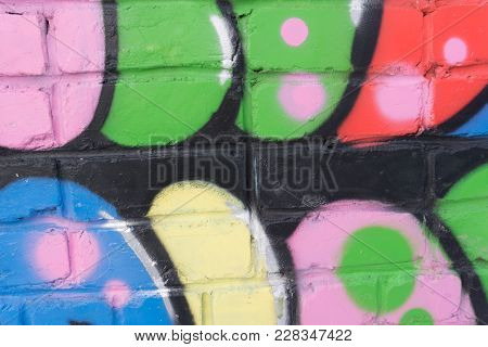 Wall Apinted With Multicolored Rainbow Paint. Yellow, Orange, Blue, Turquoise, Red, Sur, Black Color