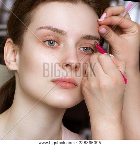 Permanent Microblasting Tattooing Freckles To A Woman In A Beauty Salon.