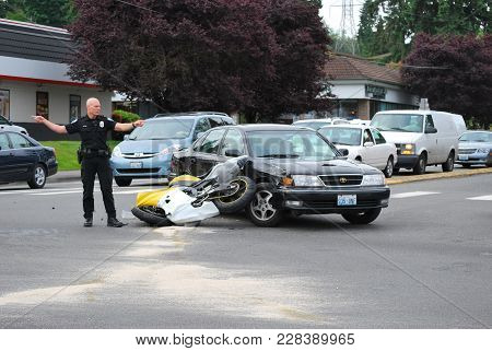 Seattle, Wa. June 12, 2008. Circa: Car Runs Into Motorcycle Trying To Make A Left Turn On The Road I