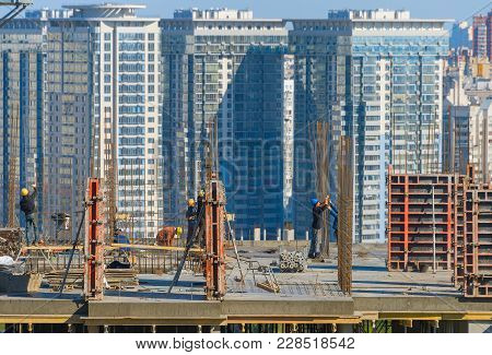 Kiev, Ukraine - October 01, 2015: Construction Workers At Work On A Top Of Building. Kiev Is The Cap