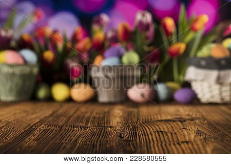 Easter Theme. Easter Eggs. Colorful Tulips. Rustic Wooden Table. Shallow Depth Of Focus. Bokeh Backg