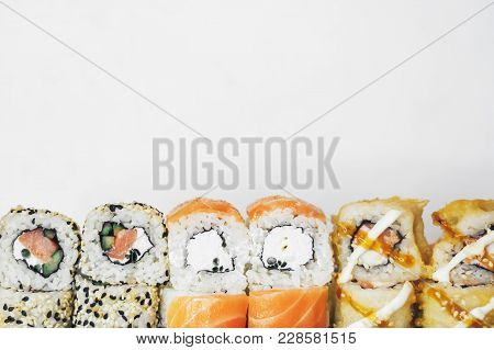 Closeup Of Traditional Sushi Roll With Fish Isolated On White Background. Sushi Bar Menu Design With