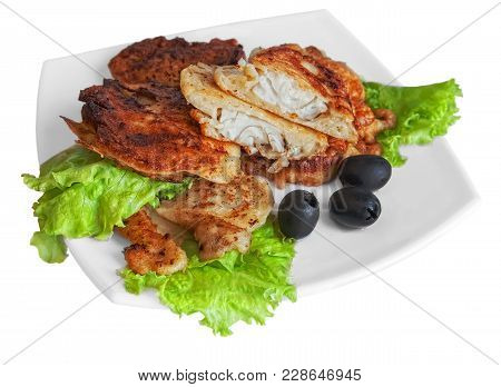 Fried Fish In Pastry On A White Plate With Salad Leaves And Black Olives. Isolated Background