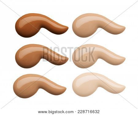 Foundation face make-up samples. Set of cosmetic liquid foundation or cream in different colour smudge smear strokes. Make up smears isolated on a white background. Foundation colors palette