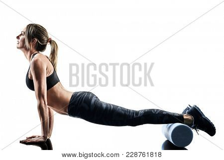 one caucasian woman exercising pilates fitness foam roller exercises isolated silhouette on white background