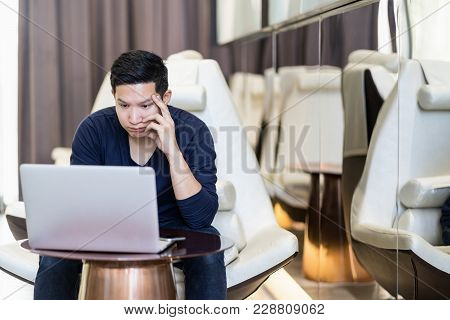 Stressed Out Asian Man Freelancer Looking Computer Laptop And Holding Hand On His Face. Young Asian 
