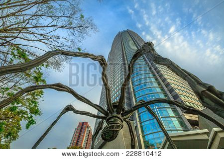 Tokyo, Japan - April 20, 2017: Low Angle View Of Mori Tower And Maman Spider Bronze Sculpture Inside