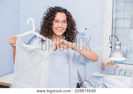 Smiling Dressmaker Thinking About Something Accidently Cutting New Nightgown. Inexperienced Tailor. 