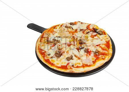 Pizza Whole Round On A Black Tray, Blackboard, Cut Into Pieces, On A White Isolated Background. Fast